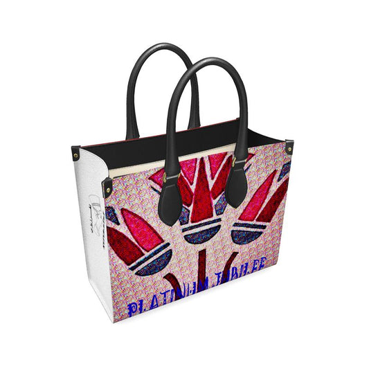 A leather bag with lotus flower on the front side and my logo in an Arabic and English writing  and Nefertiti's head.